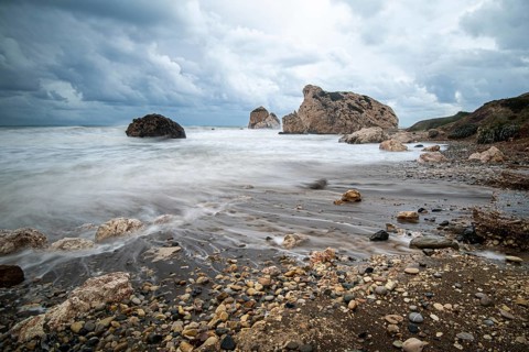 Seascape with windy waves during stormy weather at the rocky coastal area of the Rock of Aphrodite