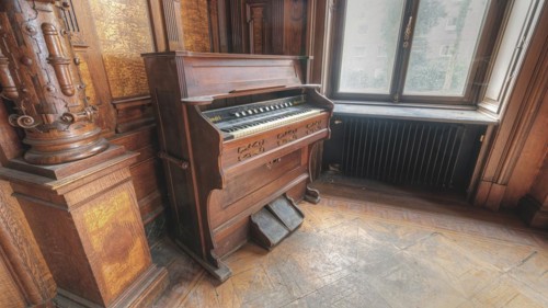 Antique wooden organ in a room with historic architecture and natural light, Villa Woodstock, Lost