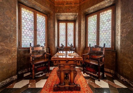 Krakow, Poland, March 23, 2024, Interior of a bowed window with stained glass, luxury chairs and a