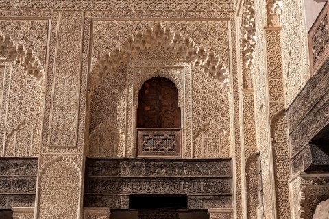 Fes, Morocco, April 05, 2023, Traditional oriental facade at the courtyard of madrasa Bou Inaniya