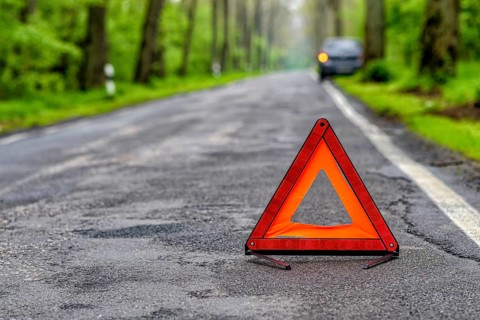 Damaged car on a country road after a breakdown