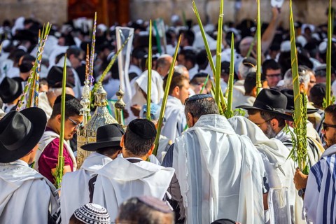 Jerusalem, Israel. Jews praying at the Western Wall wrapped in white Talit. Blessing of the Cohenim