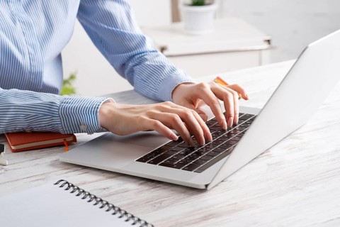 Office manager working with laptop. Corporate office workplace with computer. Business occupation