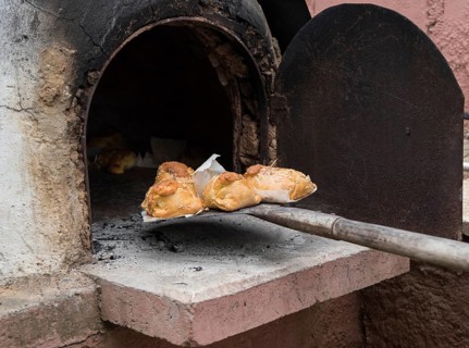 Traditional Cypriot easter pastries made with mixture of various cheese and halloumi and cooked on