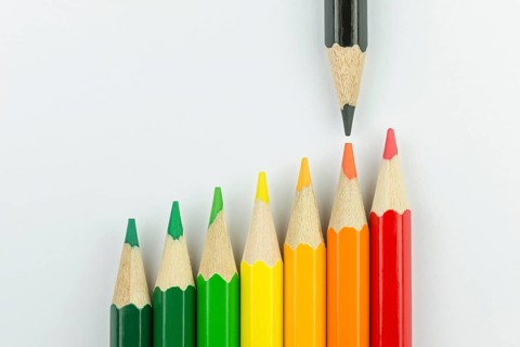 Conceptual crayons represented as successor energy label colors with black pencil that indicates