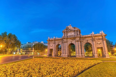 Madrid Spain, night city skyline at Puerta de Alcala