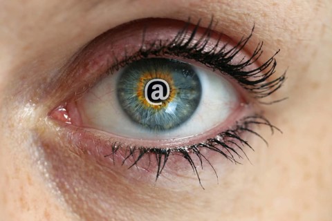 Eye with email sign in the pupil concept