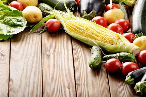 Fresh Organic Vegetable Food Ingredients on Wooden kitchen table background. Space for text