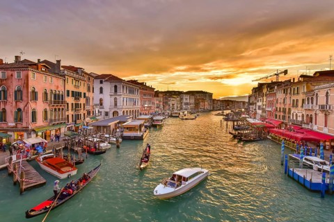 The Grand Canal with gondola and vaporetto at sunset time, Venice, Italy, Europe