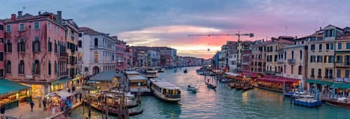 The Grand Canal with gondola and vaporetto at sunset time, Venice, Italy, Europe