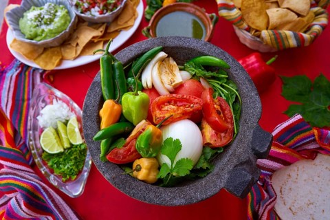 Molcajete with chili for chile ranchera sauce from Mexico