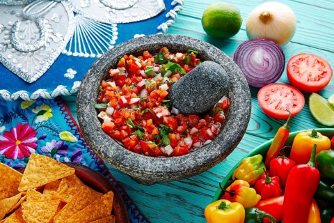 Pico de Gallo sauce from Mexico with tomato cilantro and onion in molcajete
