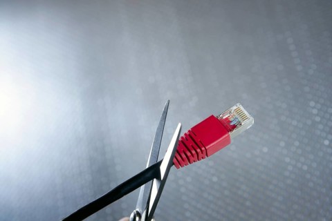 Cutting with wired technology metaphor, ethernet RJ45 cable scissors