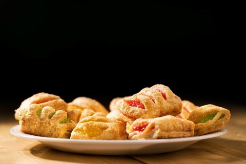 Cookies from puff pastry with coloured jam