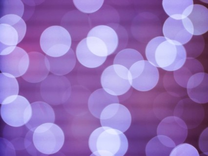 Purple abstract background with bokeh defocused lights. Soft blurred yellow and gold bokeh