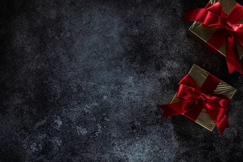 Two Golden Gift Boxes On Dark Background With Copy Space