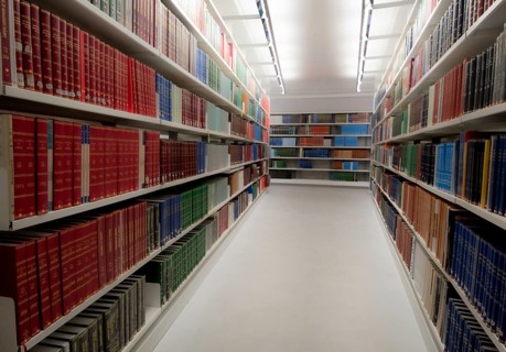 Stack of various information Books for study on a University library bookshelf