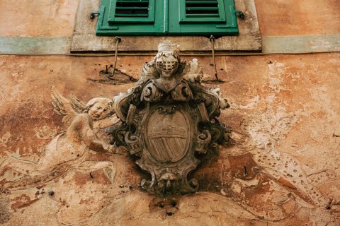 Classic outdoor bas-relief. Ancient statue on the walls of the old town of Kotor, in Montenegro