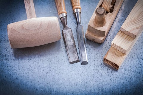 Composition of joiner's tools on metallic background construction concept
