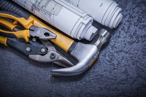 Construction drawings steel cutter pliers claw hammer on black background
