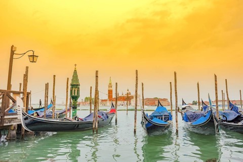 Gondolas near Saint Mark Square (Piazza San Marco) and church of San Giorgio di Maggiore in the
