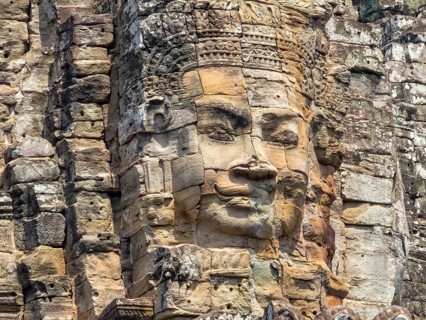 One of many stone faces of Angkor Thom, Siem Reap, Cambodia, Asia