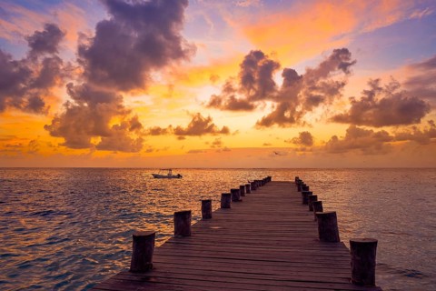 Riviera Maya pier sunrise in Caribbean Mayan Mexico