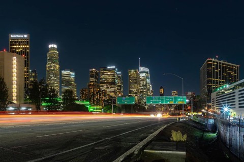 A picture of Downtown Los Angeles and the Harbor Freeway's traffic lights at night
