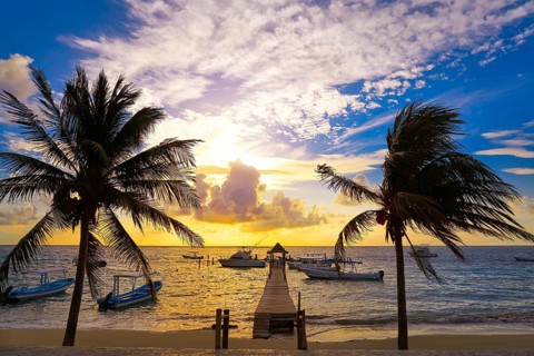 Riviera Maya sunrise pier in Caribbean Mayan Mexico