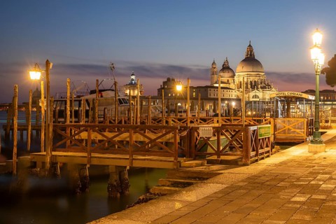 Sunset after sunset, gondola jetty, church of Santa Maria della Salute in the background, Venice,
