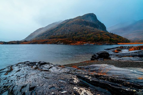 Scenic view of lake against mountian in Killarney National Park a misty day in the Ring of Kerry in