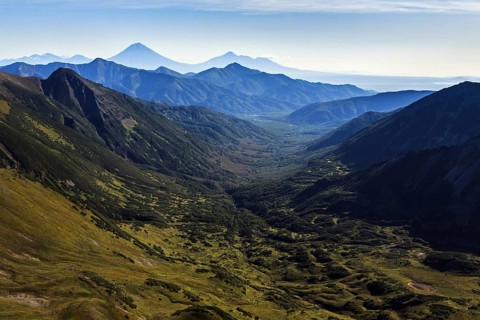 Beautiful autumn mountain landscape: scenery view of mountains, lake and volcanoes. Eurasia,