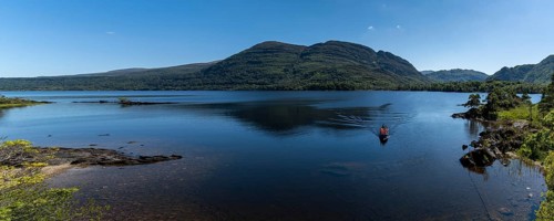 Muckross, Ireland, 10 August, 2022: tourists enjoy a boat ride on Muckross Lake in Killarney