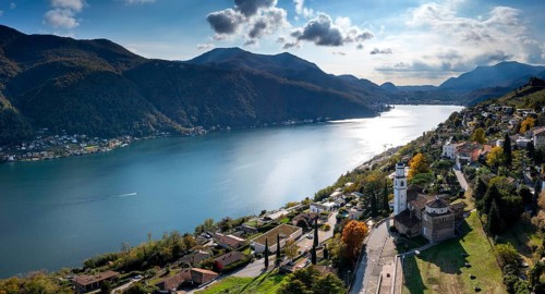 An aerial panorama view of Vico Morcote village and Lake Lugano in southern Switzerland