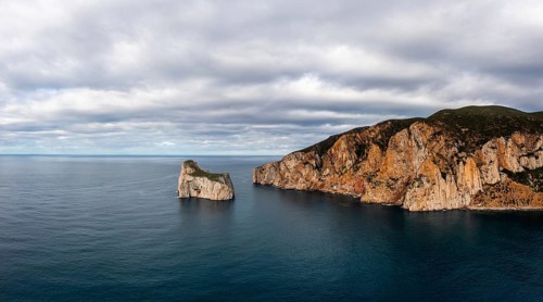 Drone panorama landscape of the cliffs and sea stacks at Porto Flavia on Sardinia