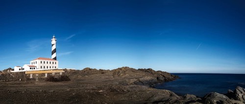 A panorama landscape of the Favaritx Lighthouse on the west coast of Menorca
