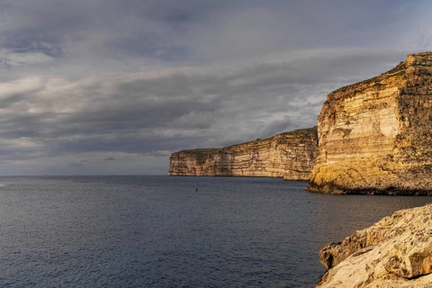 A view of the Xlendi Bay cliffs on the coast of Gozo Island in Malta