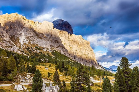 Travel in the Dolomites. Falzarego pass. Approaching snowstorm. The concept of active and adventure