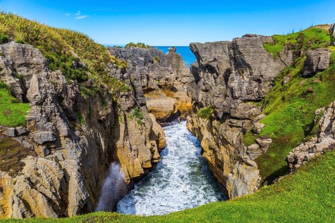 Picturesque coast of the South Island of New Zealand. Pancake rocks form narrow bays and fjords.