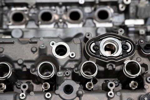 Close up of the engine (motor) of a powerful car. Metallic