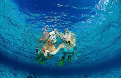 Two woman snorkelling, Komodo National Park, Indian Ocean, Indonesia, Asia