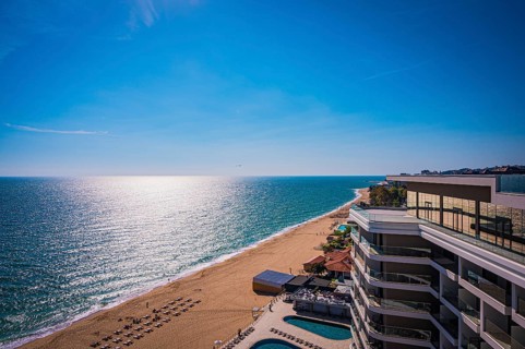 Beach view in sunny weather, the sea stretches to the horizon, Golden Sands, Varna, Bulgaria,