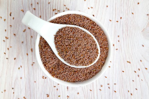 Top view of psyllium seeds in a white porcelain bowl