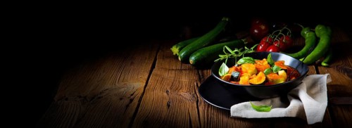 Vegetarian courgette ratatouille with tomato sauce and herbs