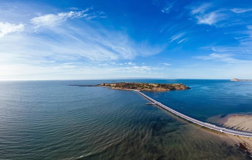 An aerial view of the famous Granite Island Recreation Park and causeway in Victor Harbor on a