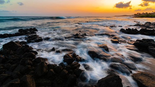 A dramatic sunset looking over the Pacific Ocean. Kauai, Hawaii