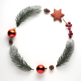 Creative concept still life holiday Christmas photo of fir branches and berries in the shape of