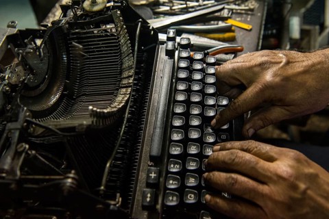 Technician repairing an old manual typewriter Mumbai, Maharashtra, India, Asia