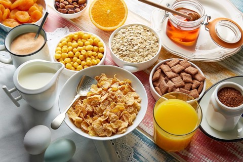 Breakfast healthy cereal coffee and orange juice and eggs