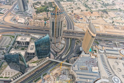 DUBAI, UAE - JANUARY 02, 2015: Dubai downtown sunrise morning scene. Top view from above